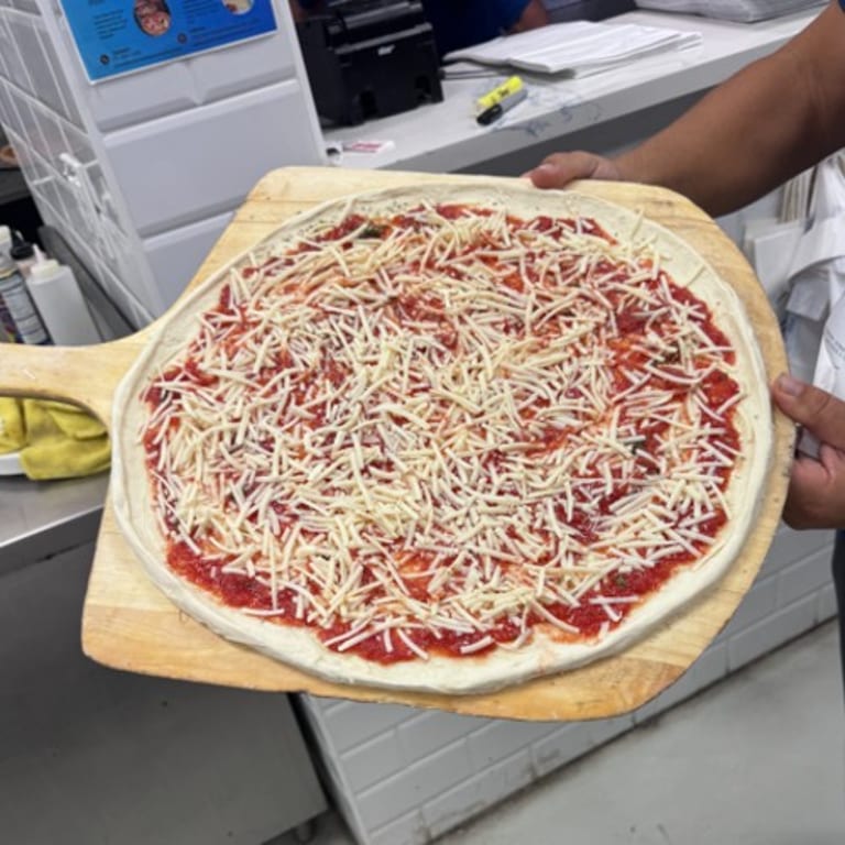 Indulge in our cheese pizza